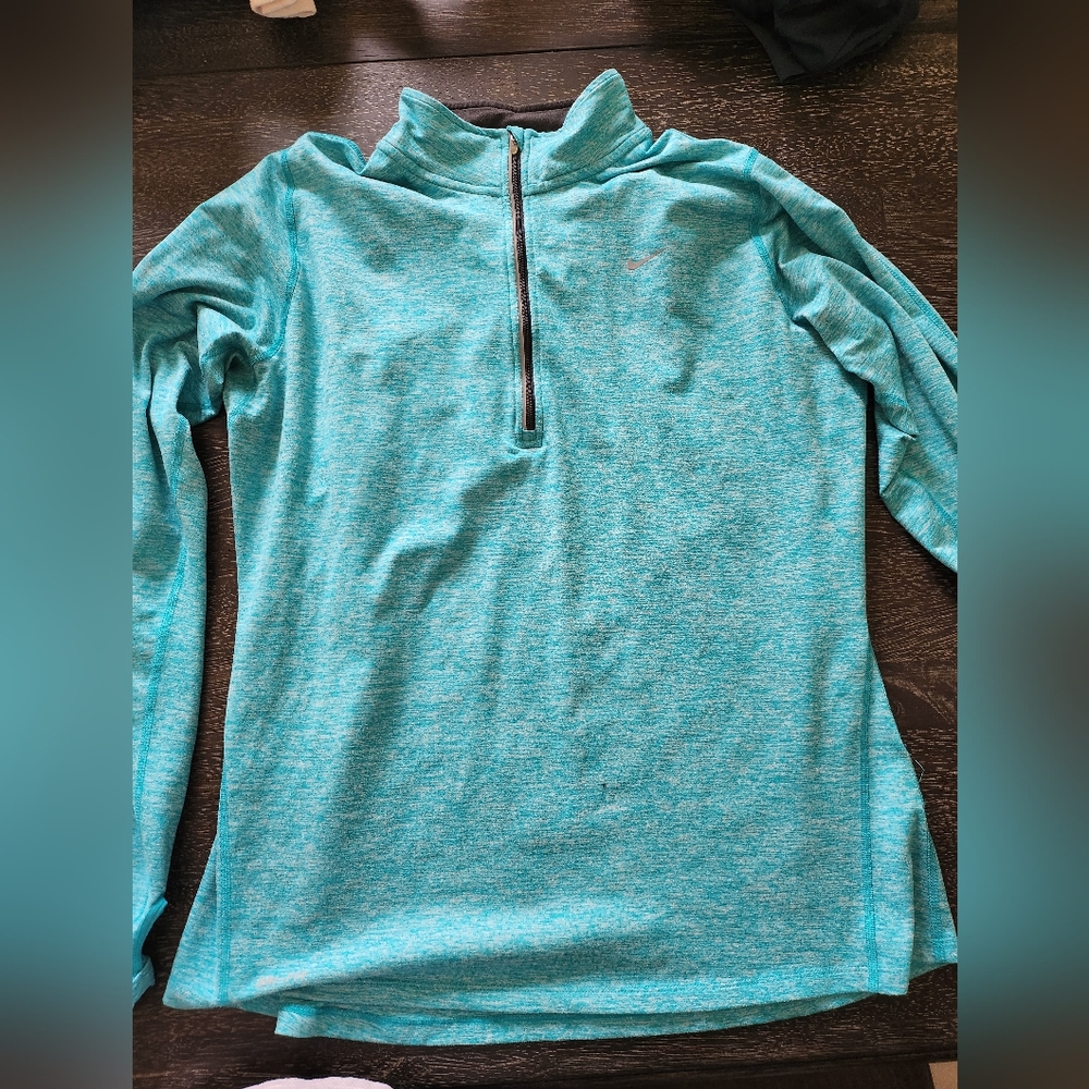 Tile running jacket by Nike. Size large